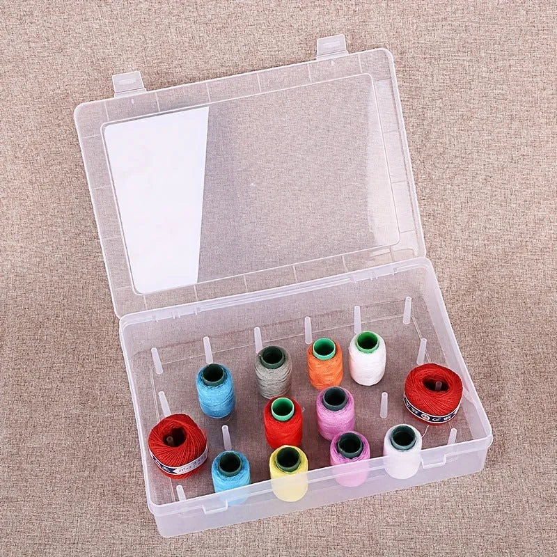 42-slot embroidery thread storage box in transparent plastic with visible spools inside