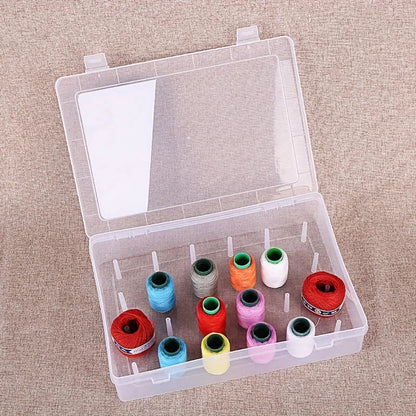 42-slot embroidery thread storage box in transparent plastic with visible spools inside