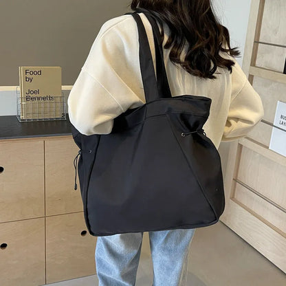 Soft Oxford cloth foldable commuter tote bag in street trend style, shown in available colours.