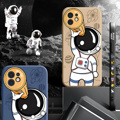 Silicone iPhone case with a cartoon astronaut and starry sky planet design.