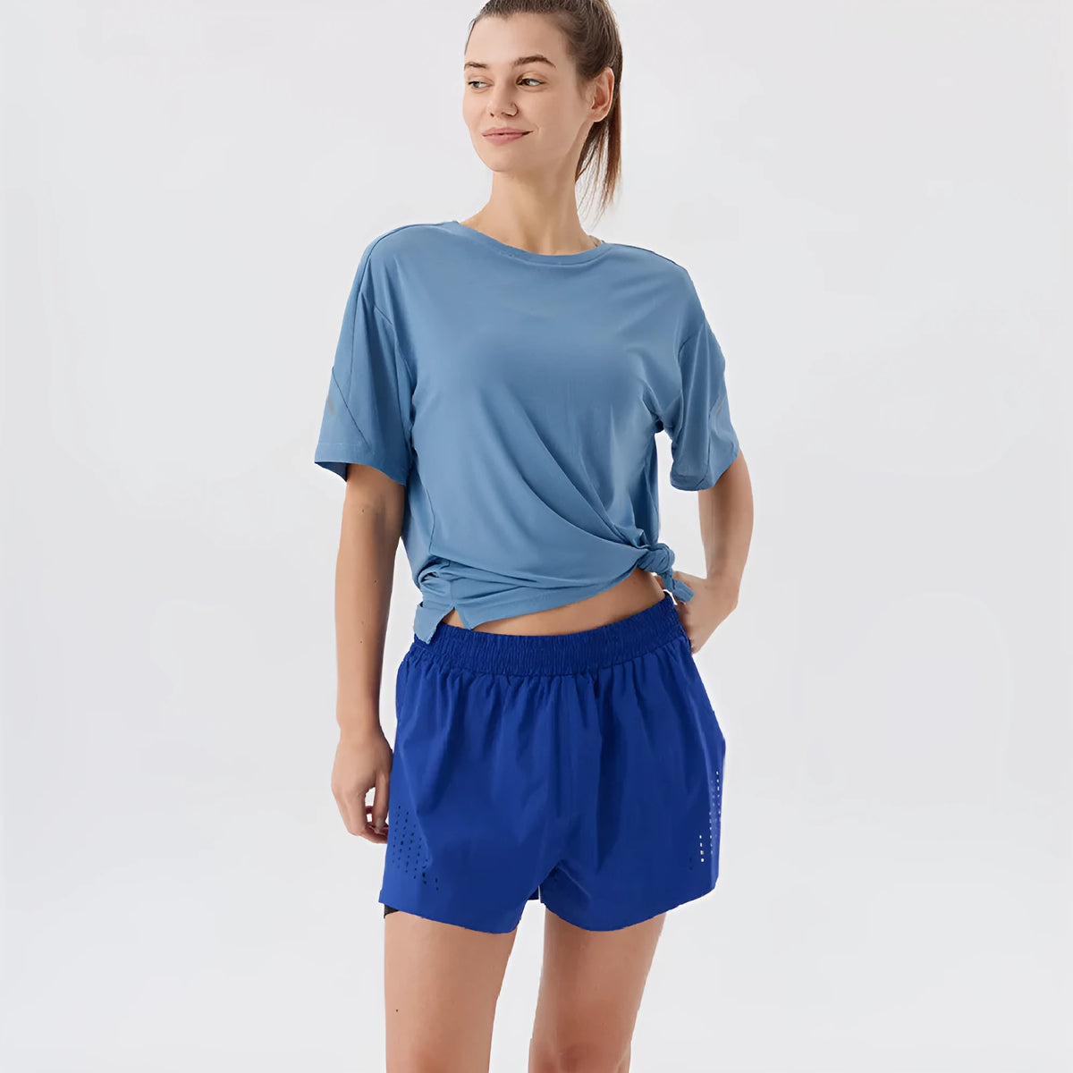 Men's side-slit sports shorts in turmeric yellow with straight leg cut and micro elastic nylon fabric