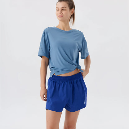 Men's side-slit sports shorts in turmeric yellow with straight leg cut and micro elastic nylon fabric
