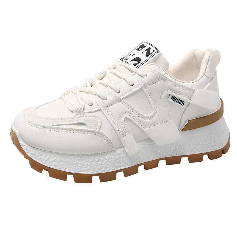 Low-top casual sneakers in black and white with rubber soles and lace-up front closure