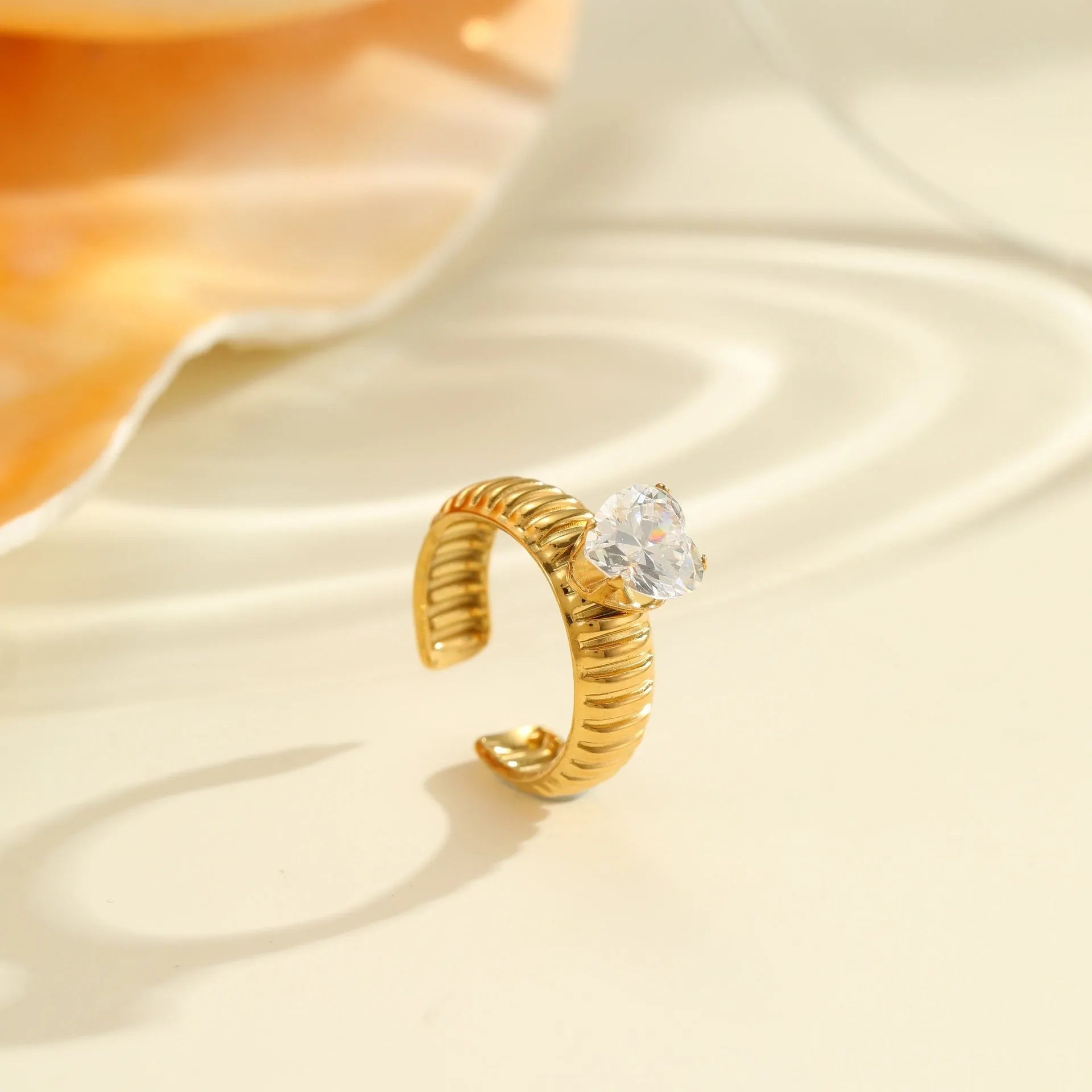 Gold electroplated stainless steel ring with heart shape design and open mouth fitting