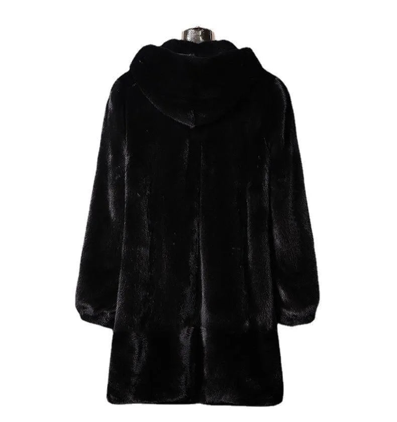 Woman wearing a long black faux fur hooded coat in a street fashion style.