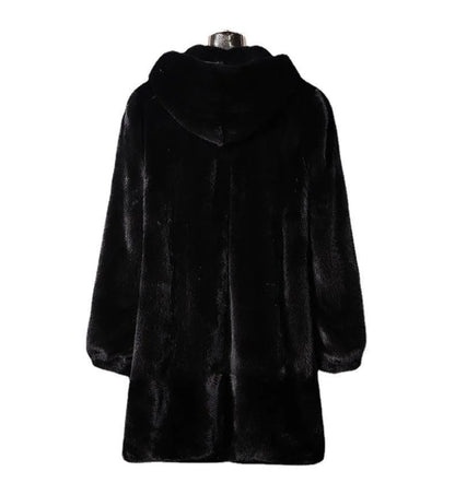 Woman wearing a long black faux fur hooded coat in a street fashion style.
