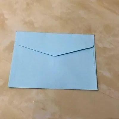 Mini coloured paper envelopes in various hues measuring 11.5 by 8 centimetres