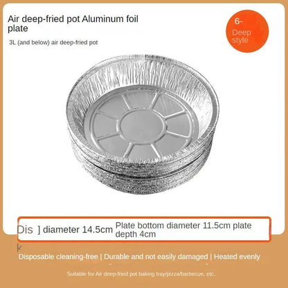 Round disposable aluminium foil liners for air fryers in four different sizes on a kitchen counter.