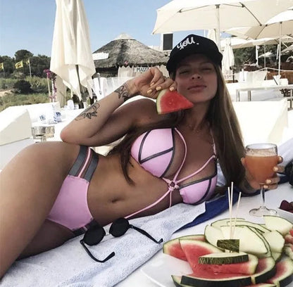 Women's bronzing bikini with padded cups in a selection of colours including black, blue, leopard print, and snakeskin print.