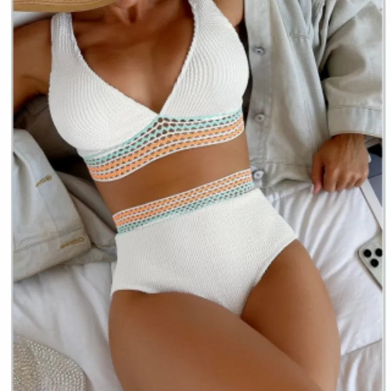 Women's high waist bikini set in solid pink colour, showing sleeveless top and briefs.