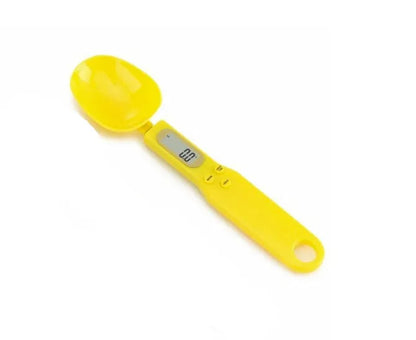 White digital spoon kitchen scale with LCD display showing weight measurement