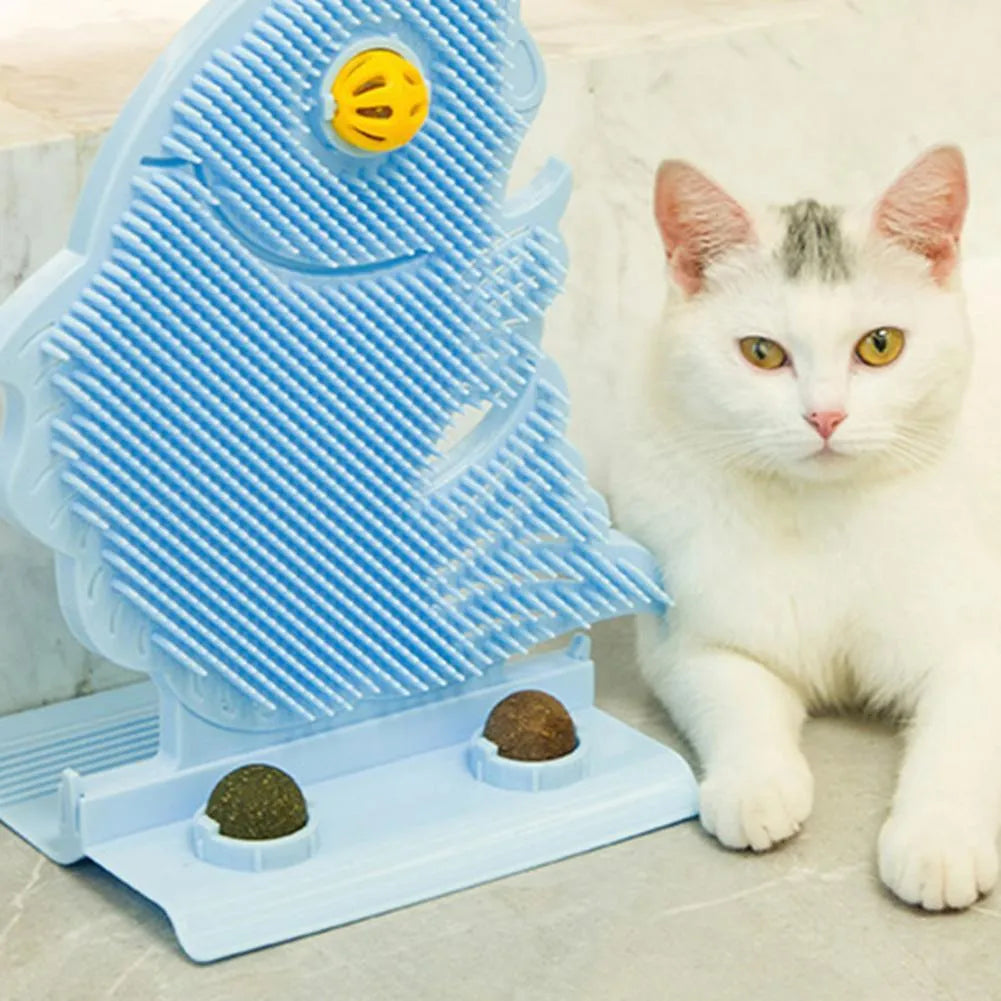 Blue plastic fish-shaped cat wall scratcher with grooming brush, catnip balls, and bell