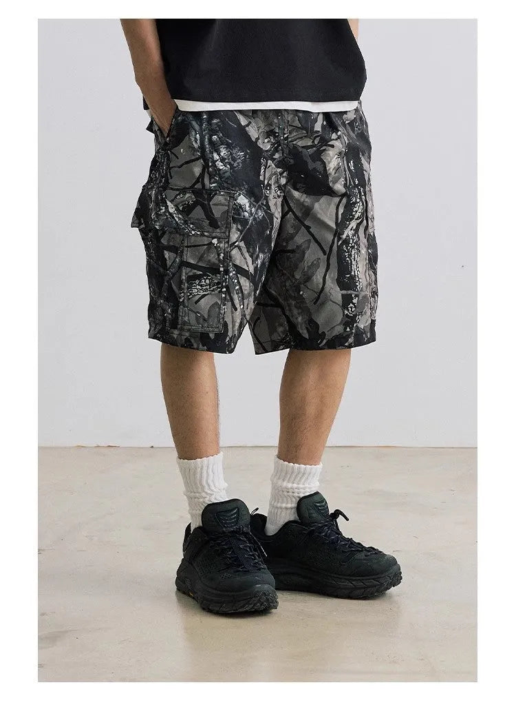 Women's loose fit denim shorts in army green colour, showing straight-leg cut and zip placket.