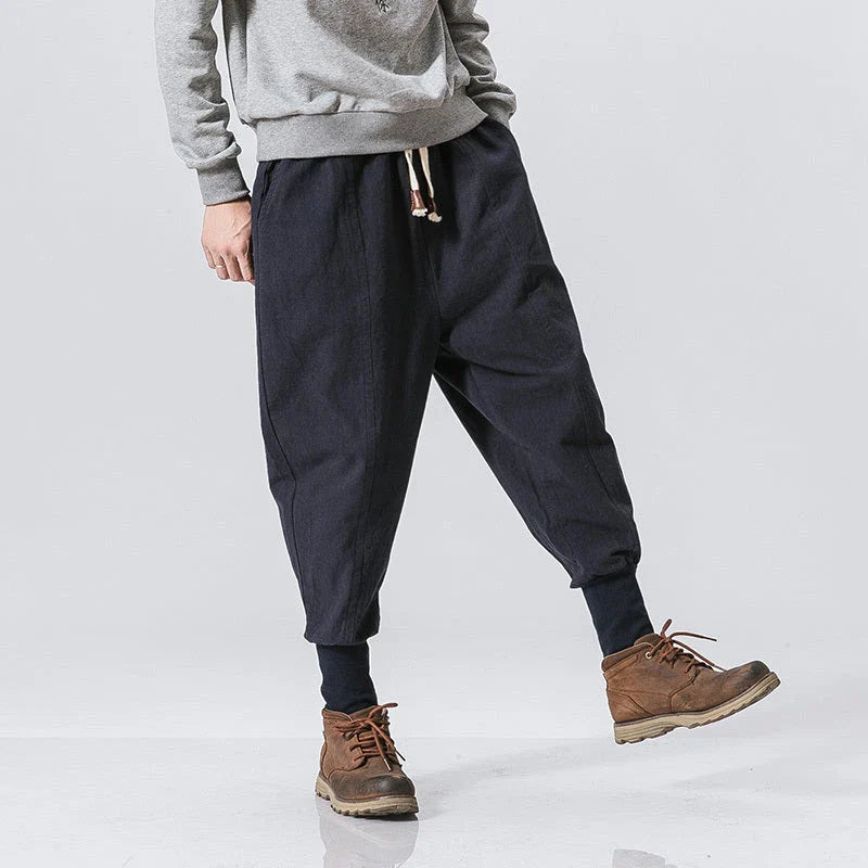 Men's harem trousers made of soft cotton and linen, featuring an elastic waistband and relaxed silhouette for all-day comfort.