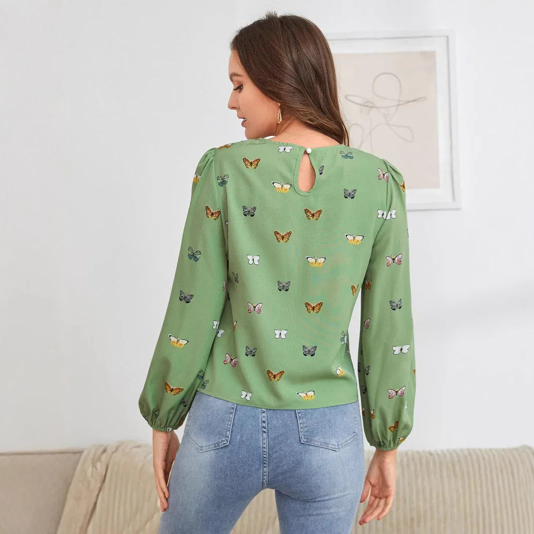 Women's butterfly print long-sleeved shirt in loose fit available in green or orange colours
