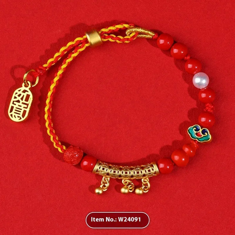 Women's hand-woven cinnabar bracelet with bell design in emperor red sand colour on red rope cord