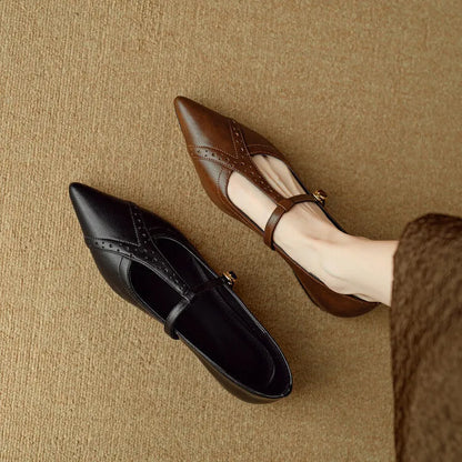 Brown women's pointed toe flat shoes with a round toe and metal detail on a casual cowhide upper.