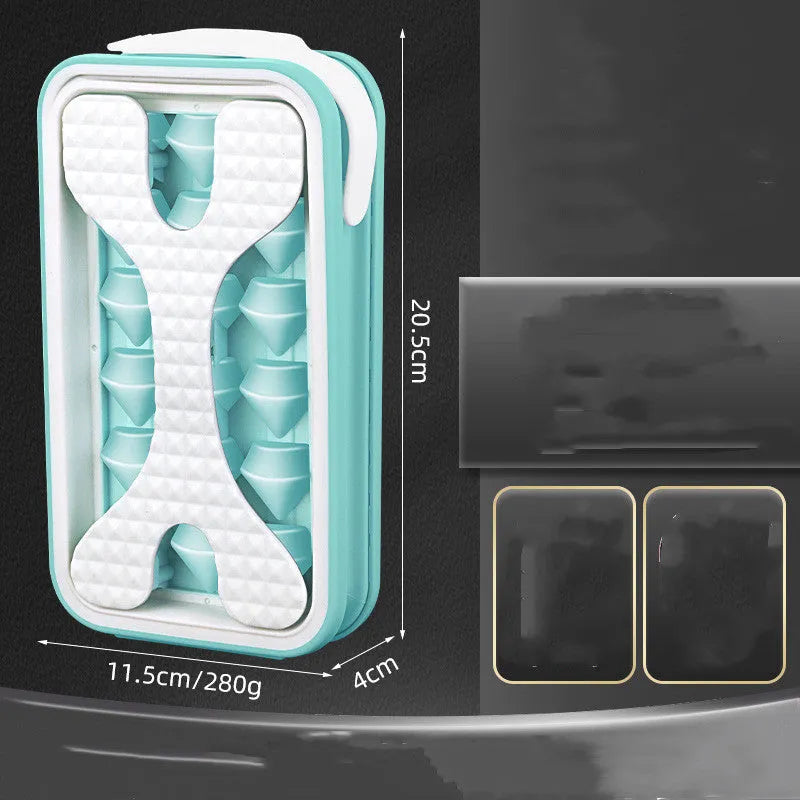 Light grey silicone ice ball mould and water bottle with lid on a kitchen counter.