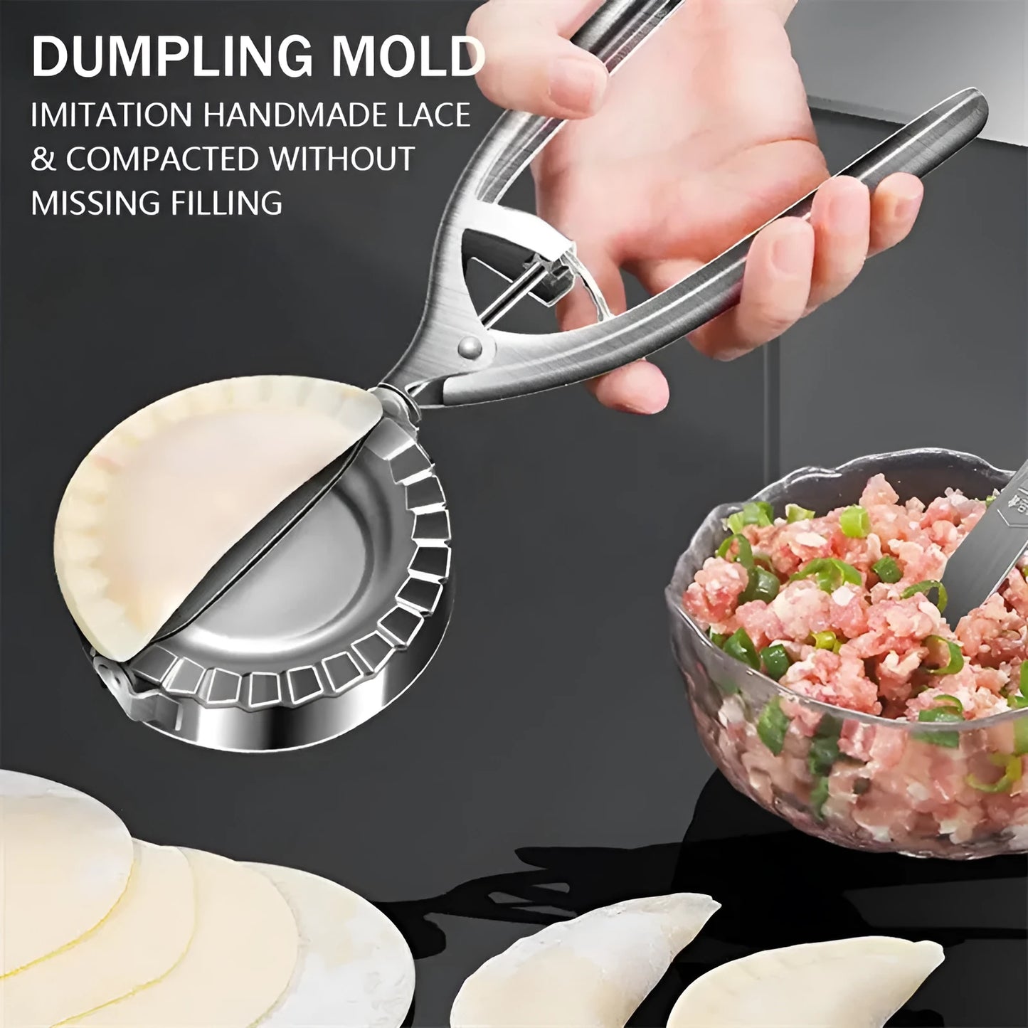 Silver stainless steel manual dumpling press tool on a wooden kitchen surface
