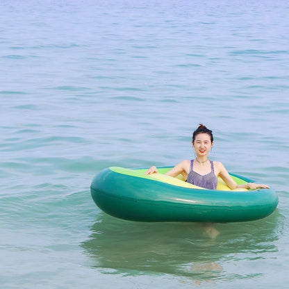 Giant avocado-shaped inflatable pool float for swimming and parties