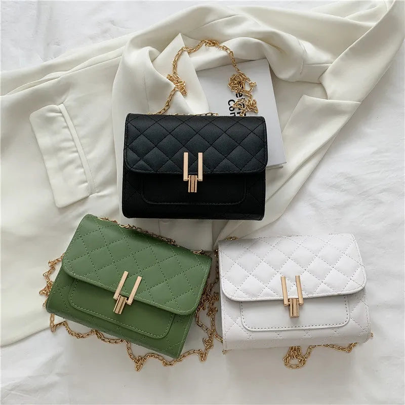 Minimalist women's crossbody bag in vegan PU leather with a diamond lattice chain strap.
