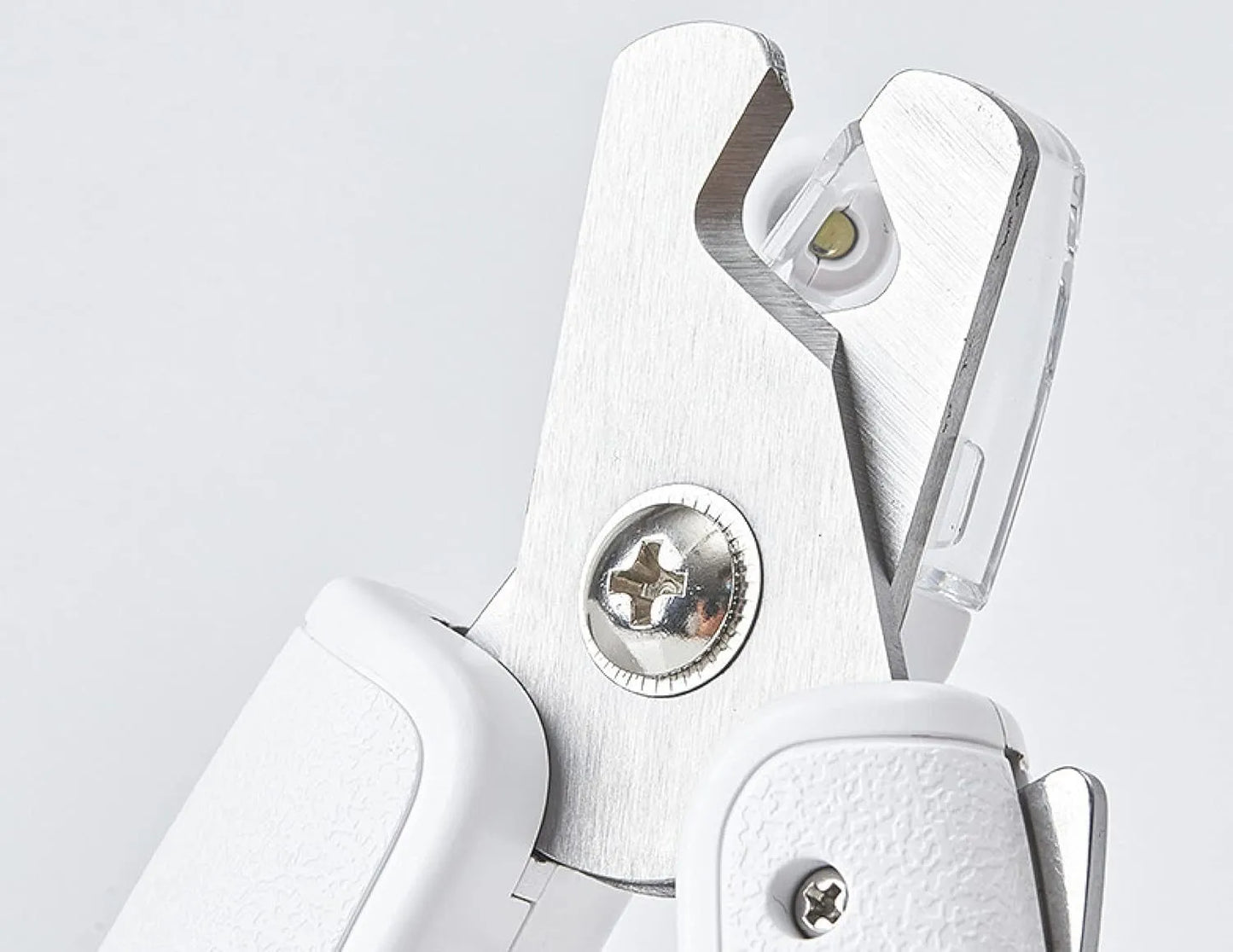 White LED pet nail clippers with a transparent safety guard and a nail file on a grey background.