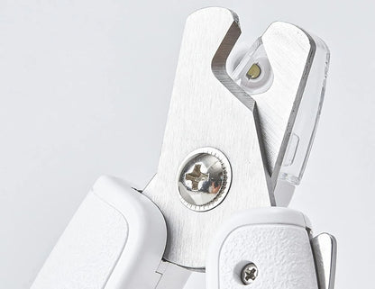 White LED pet nail clippers with a transparent safety guard and a nail file on a grey background.