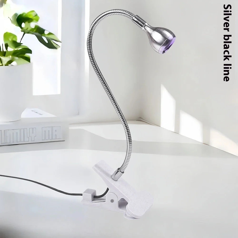 Black gooseneck UV nail lamp with clip attachment, adjustable tube, and straight light body for curing manicures