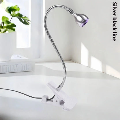 Black gooseneck UV nail lamp with clip attachment, adjustable tube, and straight light body for curing manicures