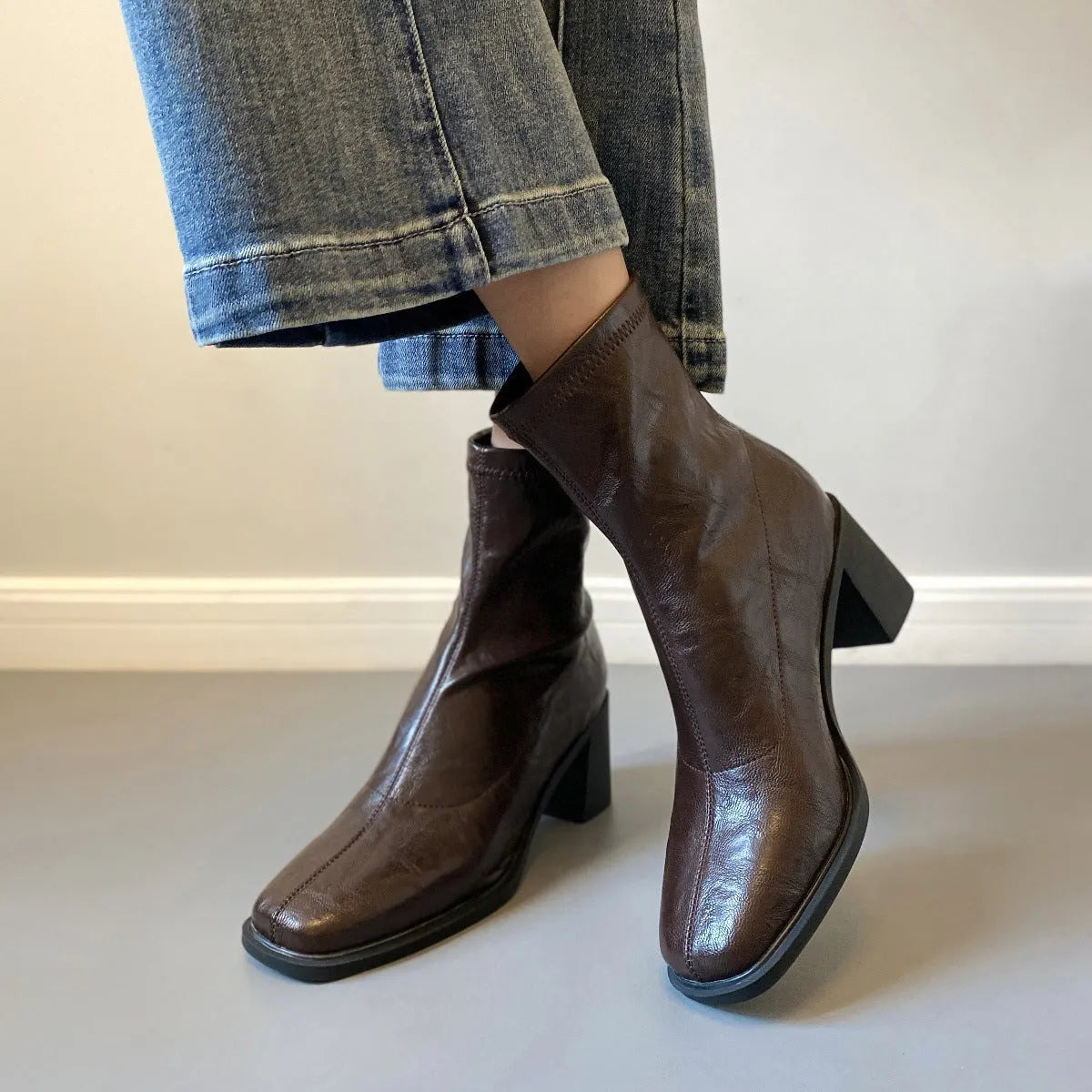 Women's retro ankle boots with chunky mid heel, square toe, back zipper, black microfibre upper, rubber sole.