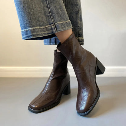 Women's retro ankle boots with chunky mid heel, square toe, back zipper, black microfibre upper, rubber sole.