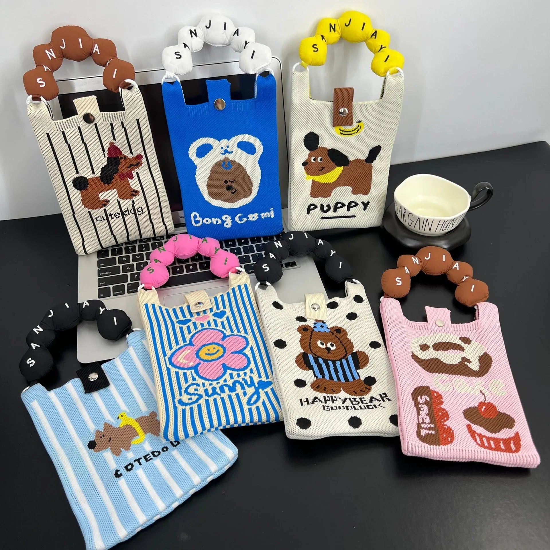 Cartoon knitted messenger bag with polyester construction and internal mobile phone storage