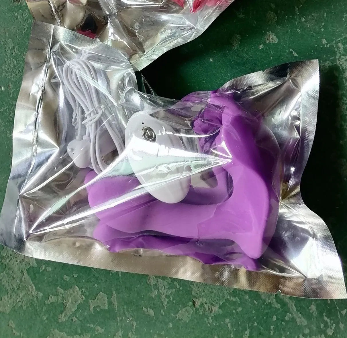 Purple and red silicone butterfly remote control dildo vibrator with USB cable.