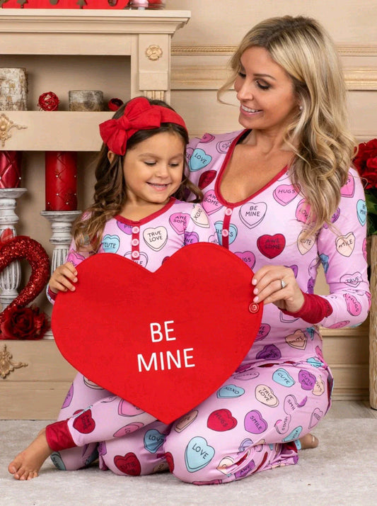 Adorable heart-printed family pajamas with long-sleeve tops and full-length bottoms in a range of sizes for children and adults.