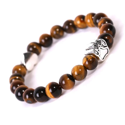 Tiger's eye stone bracelet with dog paw and Indian agate beaded designs on a wrist.