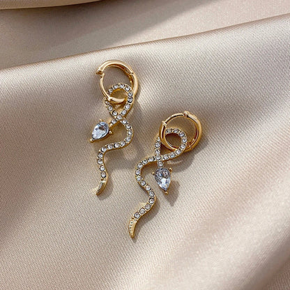 Elegant gold snake dangle earrings with a captivating serpentine design