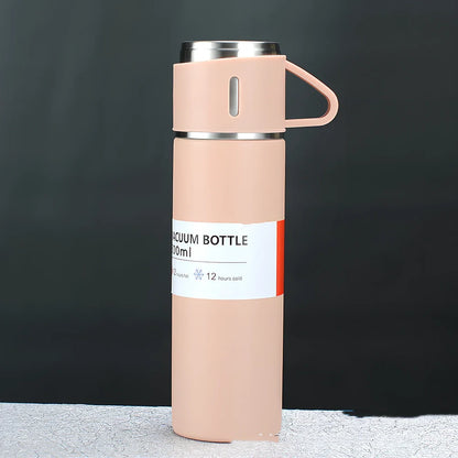Pink stainless steel vacuum water cup with straight design showing 500ml capacity and gift box packaging