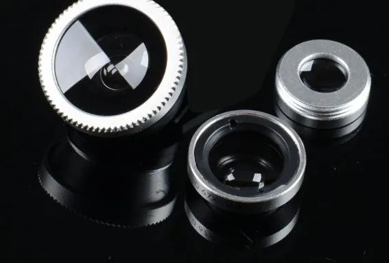 Three-in-one mobile phone camera lens kit showing fisheye, wide-angle, and macro lenses with universal clip in assorted colours.
