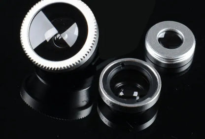 Three-in-one mobile phone camera lens kit showing fisheye, wide-angle, and macro lenses with universal clip in assorted colours.