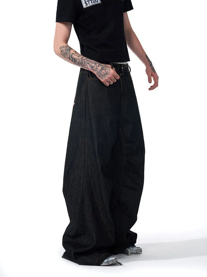 Black wide leg jeans showing loose straight fit and colour-changing embroidered red ear detail.