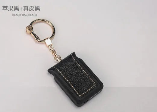 Black leather Bluetooth Dual SIM Adapter keychain with Nano SIM slot and Micro USB port.