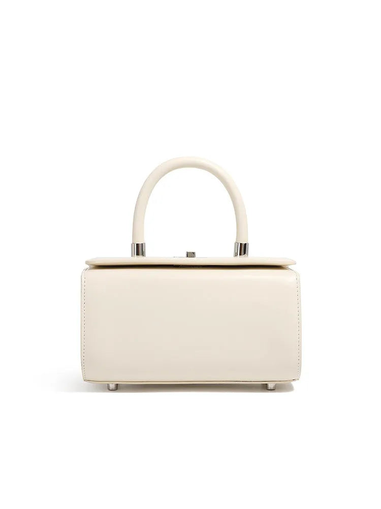Women's leather one-shoulder crossbody bag in cowhide with clamshell design and internal phone pocket