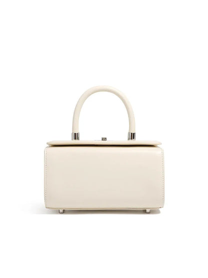 Women's leather one-shoulder crossbody bag in cowhide with clamshell design and internal phone pocket