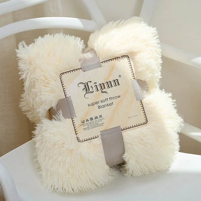 Soft coral fleece blanket in various colours and sizes for home and travel comfort