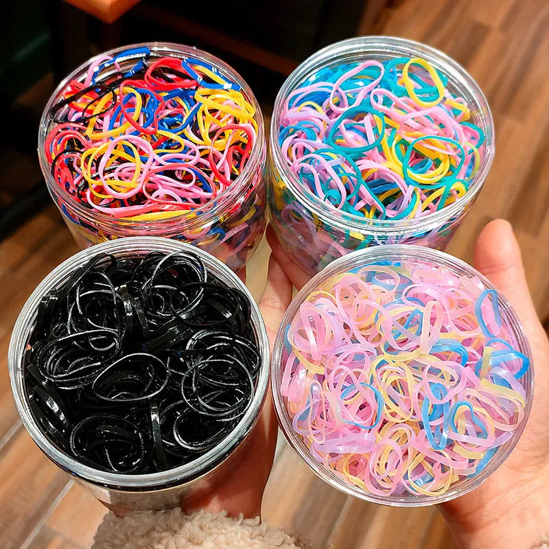 Baby Hair Ties Thin Small Hair Elastics For Toddlers Infants Kids Girls Made From TPU Material In Assorted Colours 300 Or 600 Piece Pack With Reusable Storage Container