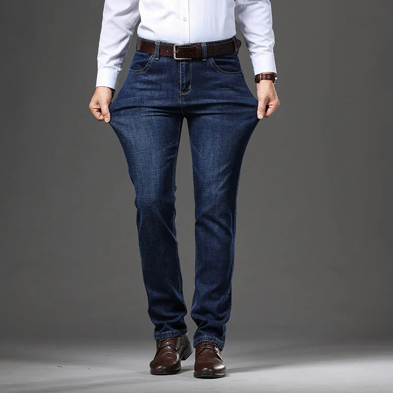 Men's straight-leg stretch jeans in black or blue denim with a zip fly, shown laid flat.