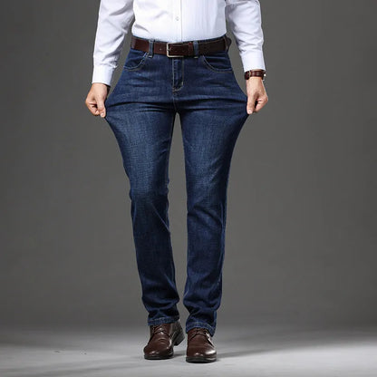 Men's straight-leg stretch jeans in black or blue denim with a zip fly, shown laid flat.