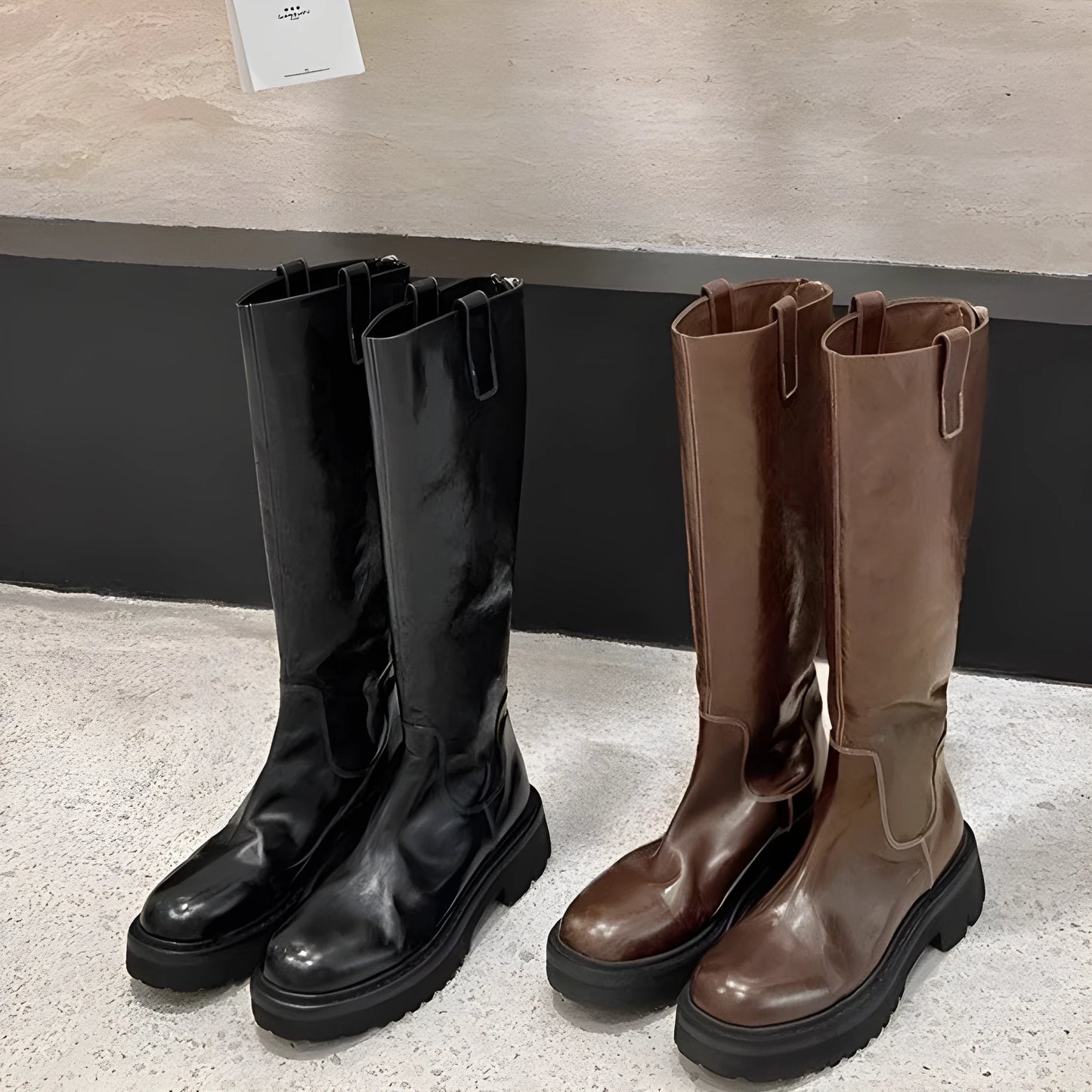Round toe black chunky heel women's knight boots with a back zipper on a rubber sole.