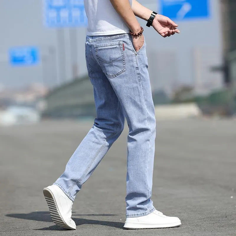 Men's smoky gray straight leg jeans with high elasticity fabric and low waist design