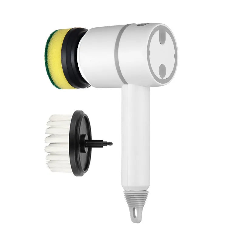 Green electric cleaning brush with multiple brush heads on a kitchen worktop.